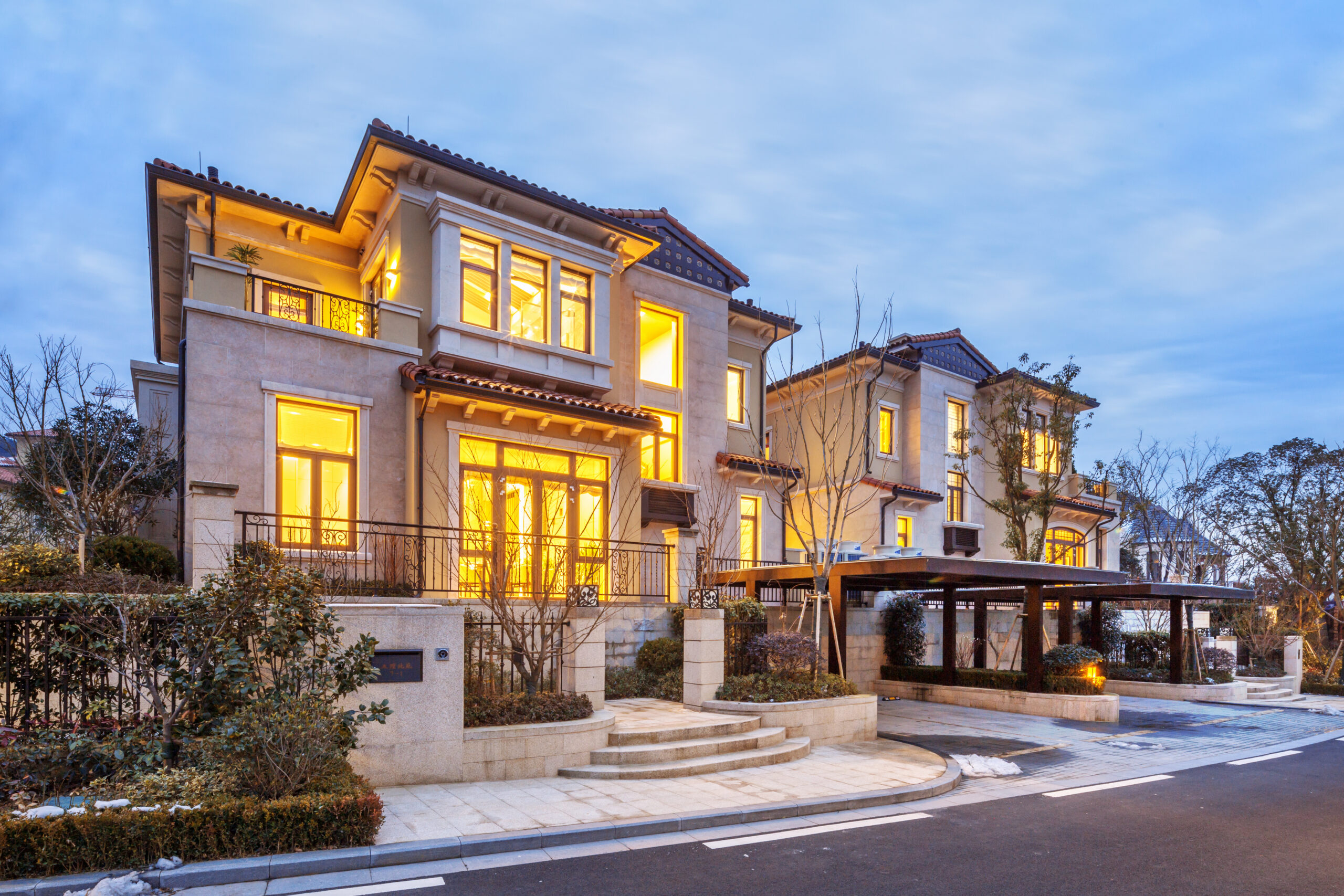 luxury houses with yellow light in modern villa at night